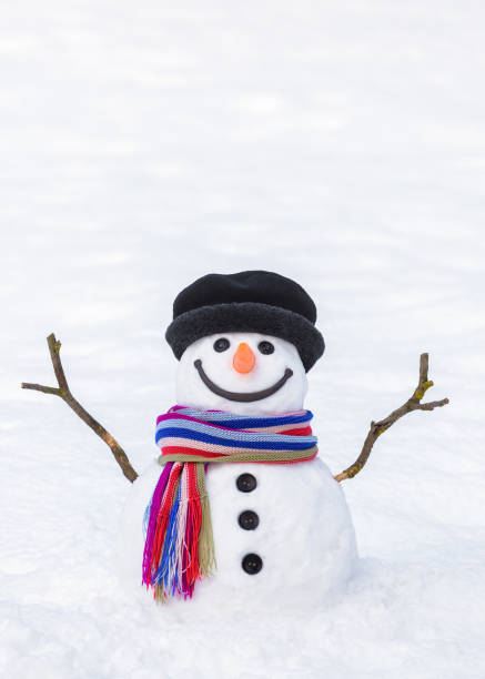 istock Funny snowman with a colorful scarf 1180836639
