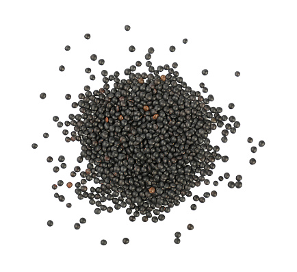 Close up heap of black Beluga lentil lens isolated on white background, close up, elevated top view, directly above