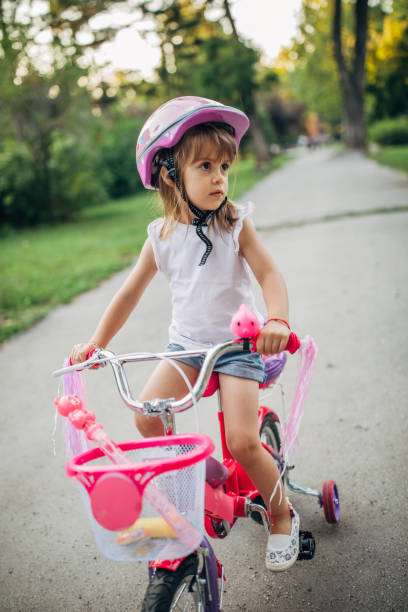 istock Girl learning to drive a bike 1180839880