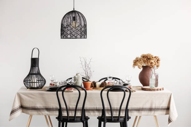 istock Black chairs, lantern and lamp in vintage dining room 1180840281