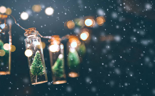 istock Close-up, Elegant Christmas tree in glass jar with snowflakes background. copy space. 1180841047