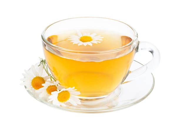 istock Glass cup of chamomile tea isolated on white background with clipping path 1180841919
