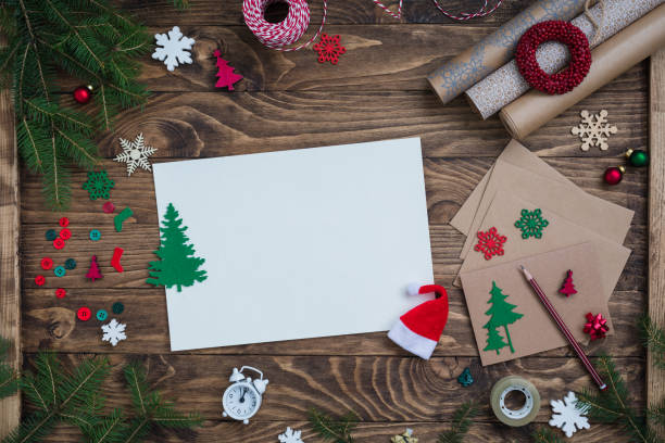 istock The composition with Christmas and New Year wish list, congratulations and postcard writing accessories, flat lay, toned 1180842840
