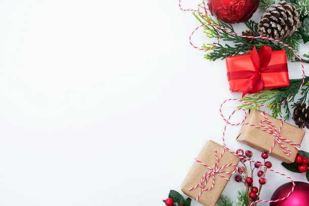 istock Christmas background, mock up with gift boxes and winter decoration., on white background. Winter holidays. Top view with copy space. 1180843085