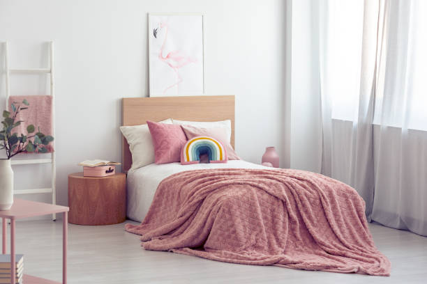 istock White and pastel pink scandinavian bedroom interior for kid 1180843193