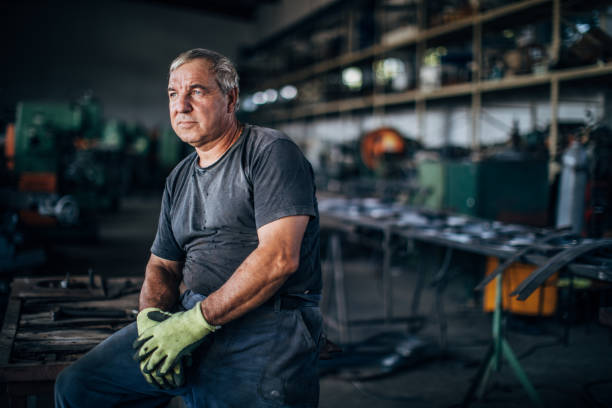istock Senior man in metal factory 1180843210