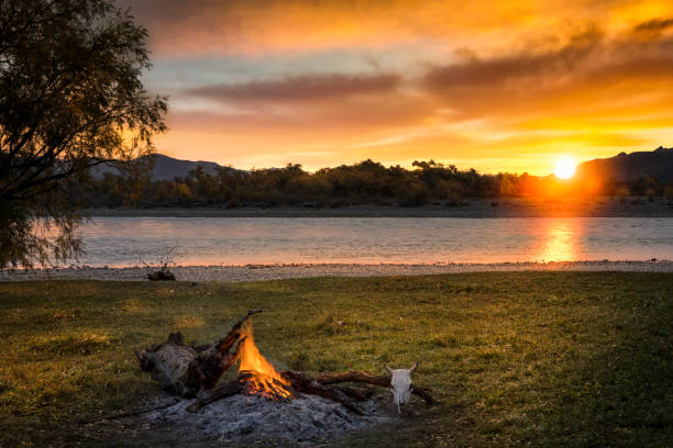 istock Campfire at Sunrise at River Eg, natural paradise in Mongolia 1180846743