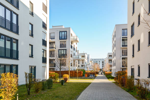 Modern apartment buildings in a green residential area in the city Modern apartment buildings in a green residential area in the city courtyard photos stock pictures, royalty-free photos & images