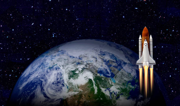 istock Space shuttle orbiting Earth planet. Elements of this image furnished by NASA 1180849992