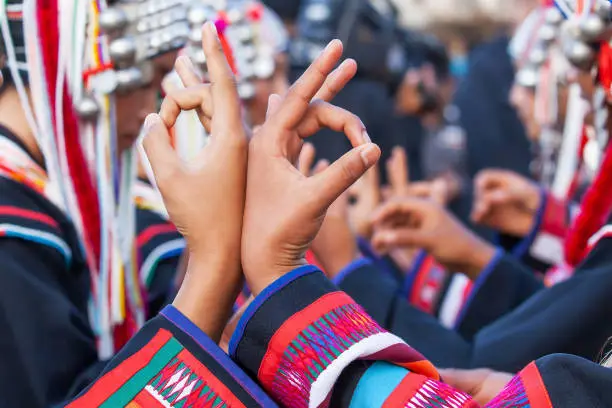 Photo of Beautiful hands of Akha hill tribe women dancing in traditional festival.