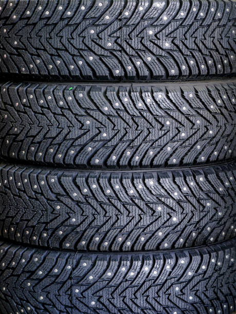istock new winter tire set with studs at tire shop 1180850788
