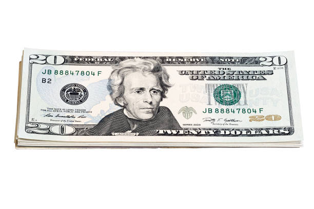 istock Stack of 20 Dollar Bills isolated on white close up. 1180852371