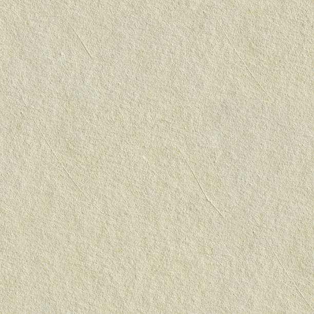 istock Recycled paper texture background in light cream sepia color tone. Seamless square texture 1180852932