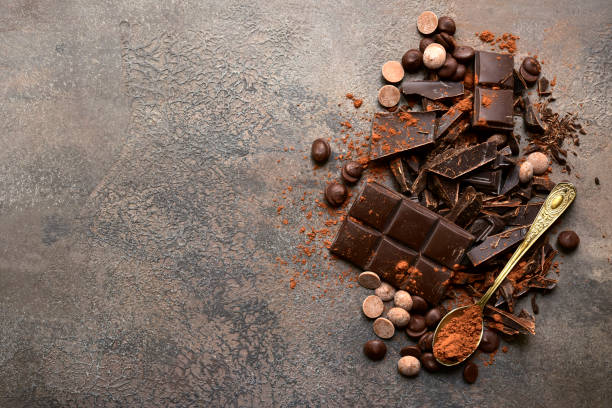 istock Milk and dark chocolate with cocoa powder 1180854723