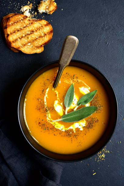 istock Creamy pumpkin soup with sage 1180855099