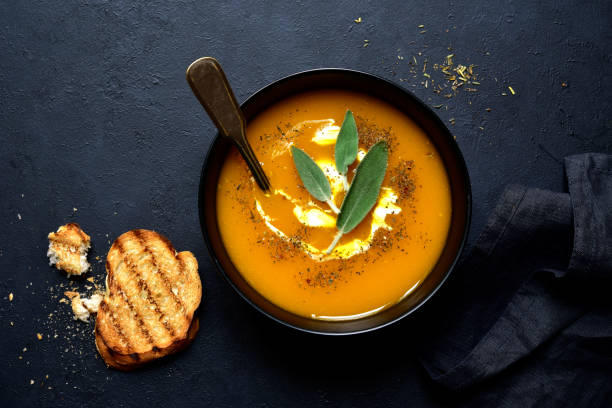 istock Creamy pumpkin soup with sage 1180855130
