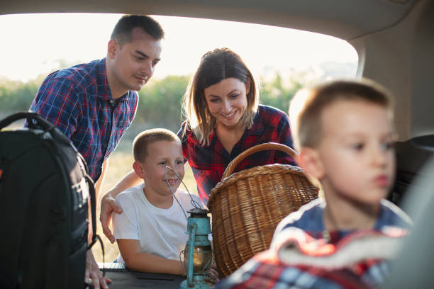 istock Family with children packing for picnic 1180856549