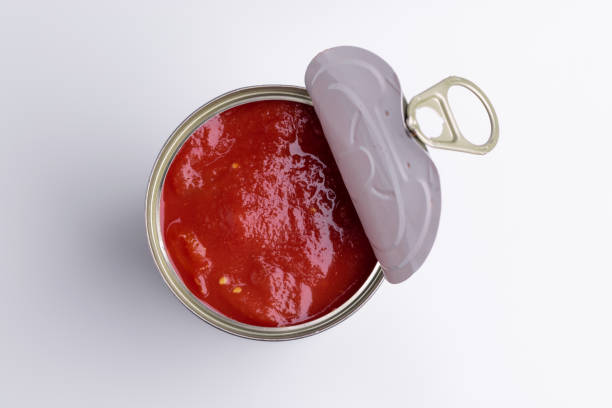 istock Tin of chopped canned tomatoes, isolated on white background, soft light 1180857930