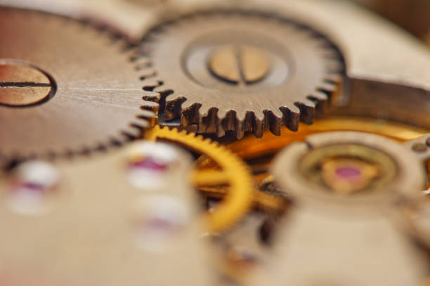 istock Cog wheels. Yellow gears, clockwork. The concept of time, teamwork, success 1180857957