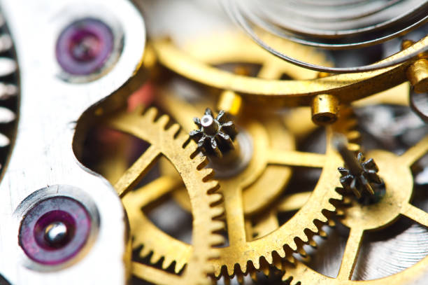 istock Cog wheels. Yellow gears, clockwork. The concept of time, teamwork, success 1180858047
