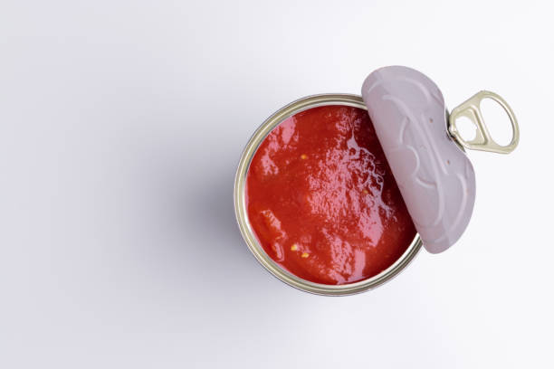 istock Tin of chopped canned tomatoes, isolated on white background, soft light 1180858101
