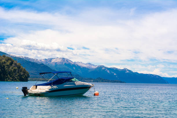 istock Boats sailing on calm lake water. 1180858356