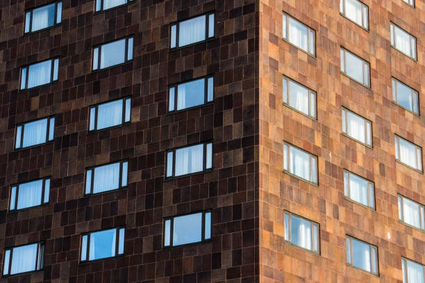 Geometric visual pattern of the windows of a building at sunset