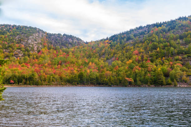 istock Fall foliage on the other side of Jordan Pond 1180860536