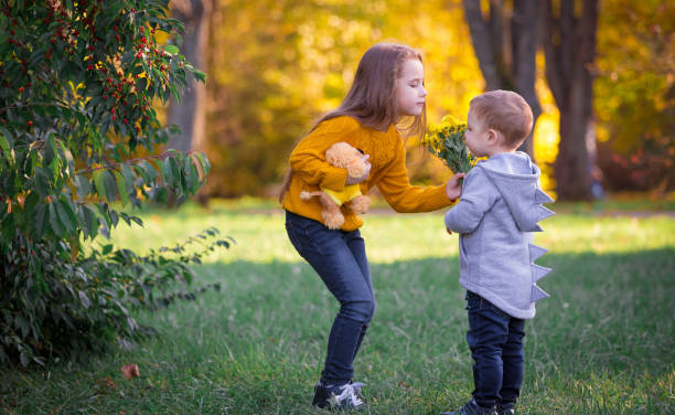 istock Boy and girl, autumn landscape 1180862540