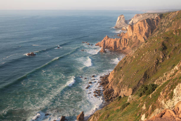 istock Waves and cliffs on Cabo da Roca, Portugal. 1180863464