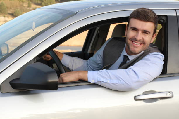 istock Elegant male driver with a gorgeous smile 1180866414