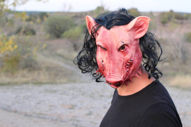 istock Scary man wearing pig mask 1180866515