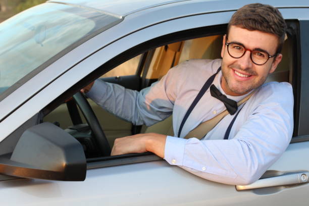 istock Posh driver wearing bowtie and suspenders 1180866517