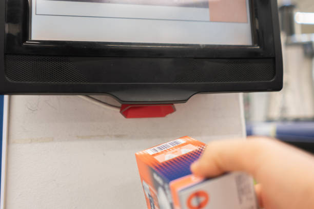 istock close up consumer check the price in the store using rfid scanner 1180867596