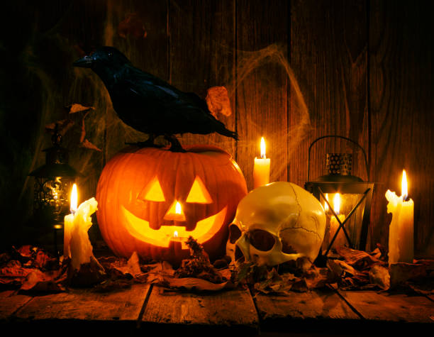 istock Halloween Jack-o-Lantern Pumpkins on rustic wooden background 1180869062