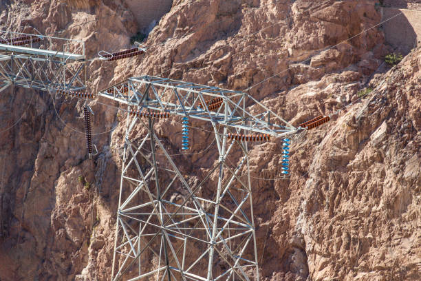istock Overhead high-voltage electric lines supplying remote area with power 1180877669
