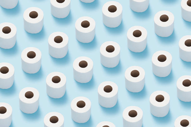 istock Toilet paper roll flat lay on blue background. 1180879528