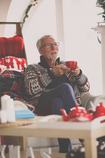 istock Senior man relaxing with a cup of tea at home 1180882471