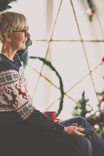 istock Retired woman relaxing at home 1180882476