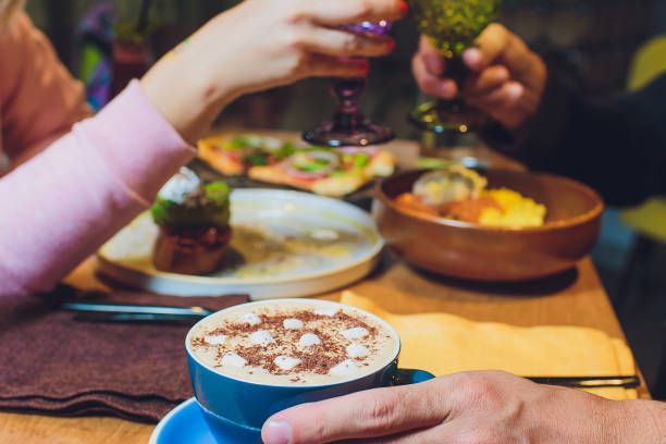 istock Mug of hot chocolate with marshmallows on table. 1180883068