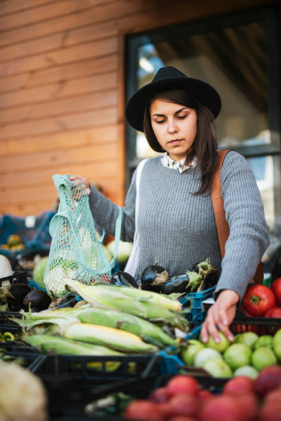 istock Woman Buying Fruit And Vegetables 1180883142