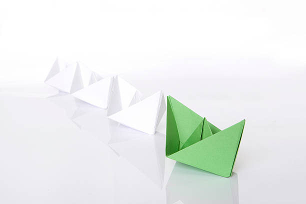 istock Winning green paper boat origami 118088612
