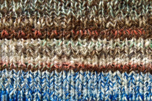 istock Handmade knitted bright multi color striped fabric 1180888726