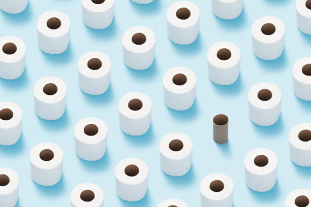 istock Toilet paper roll flat lay on blue background. 1180888781