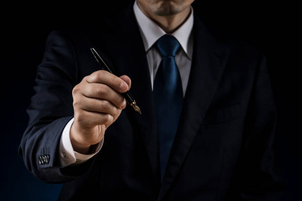 istock Man with a fountain pen in his hand 1180890991