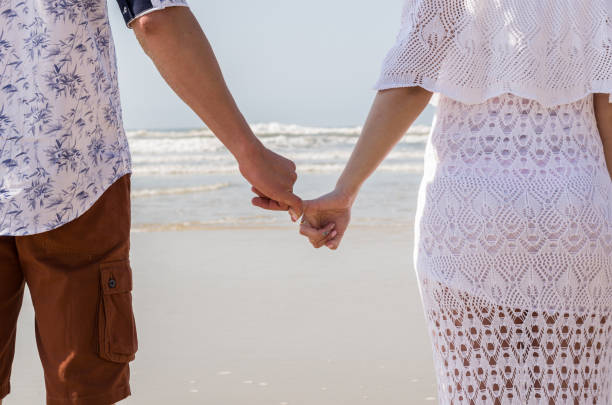 istock Pre wedding couple and amazing landscape in Torres beach. 1180891774