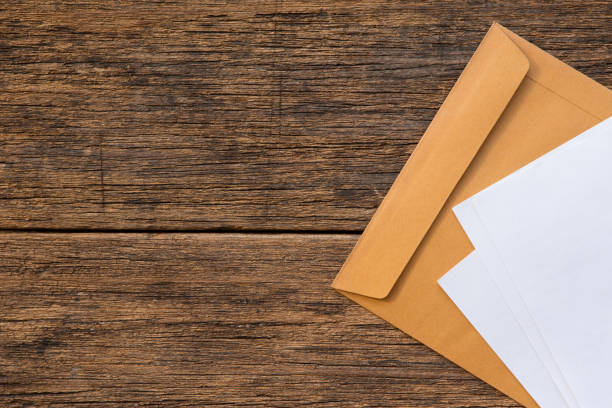 istock Top view of Documents and envelopes on wooden background and copy space 1180891964