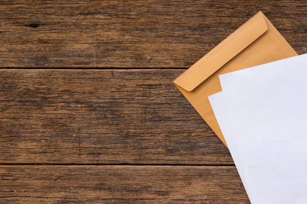 istock Top view of Documents and envelopes on wooden background and copy space 1180891985
