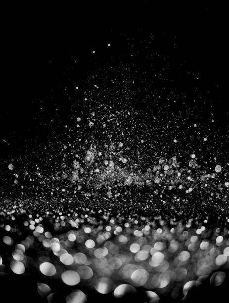 istock glitter lights grunge black and white background for graphic design resources. 1180892584