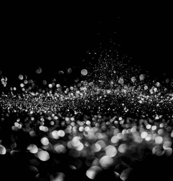 istock glitter lights grunge black and white background for graphic design resources. 1180893412